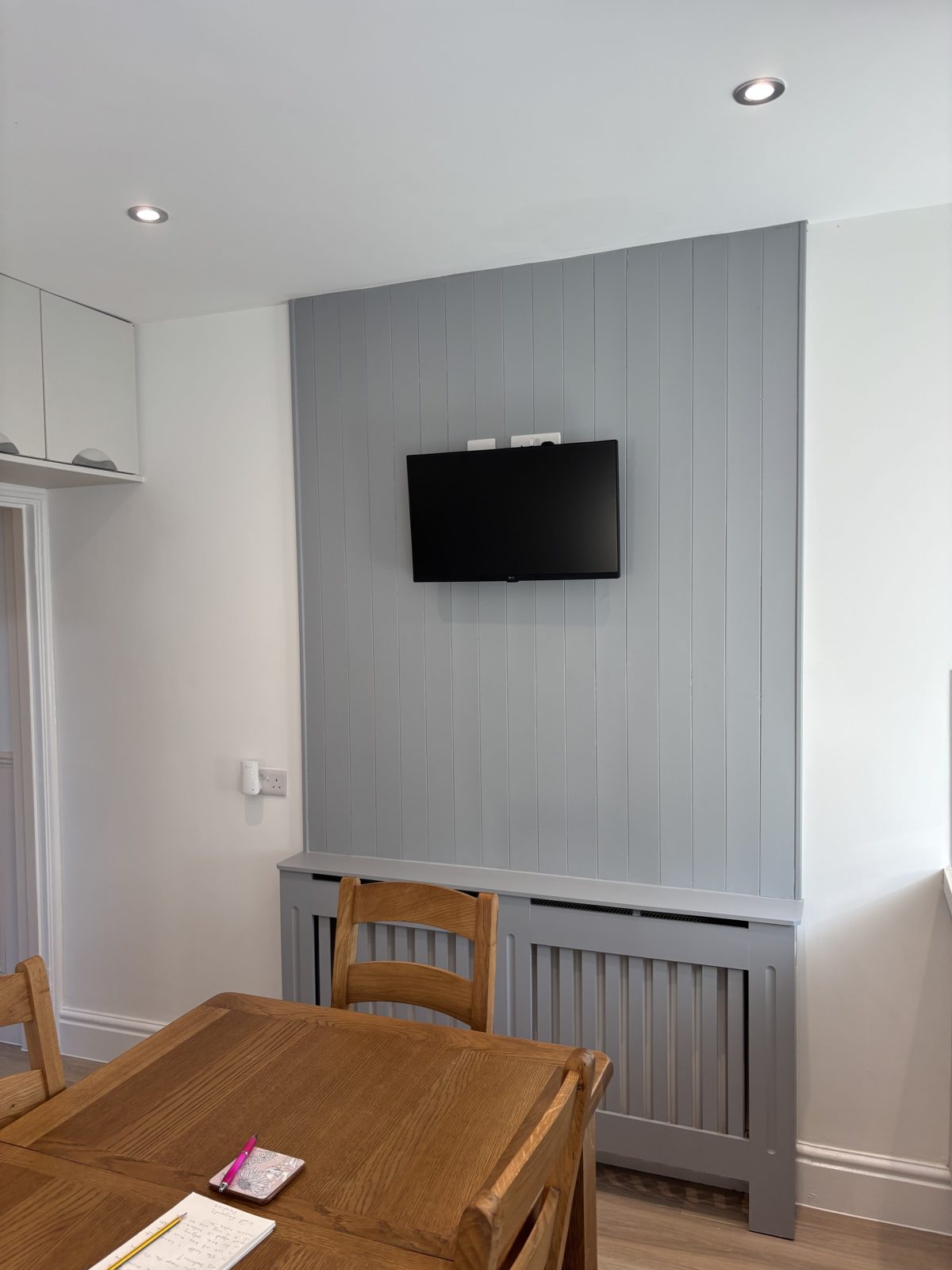 New kitchen with media wall after renovation, North Devon