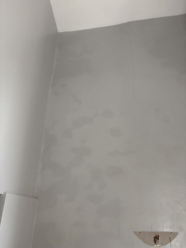 Close-up of blown plaster and cracking