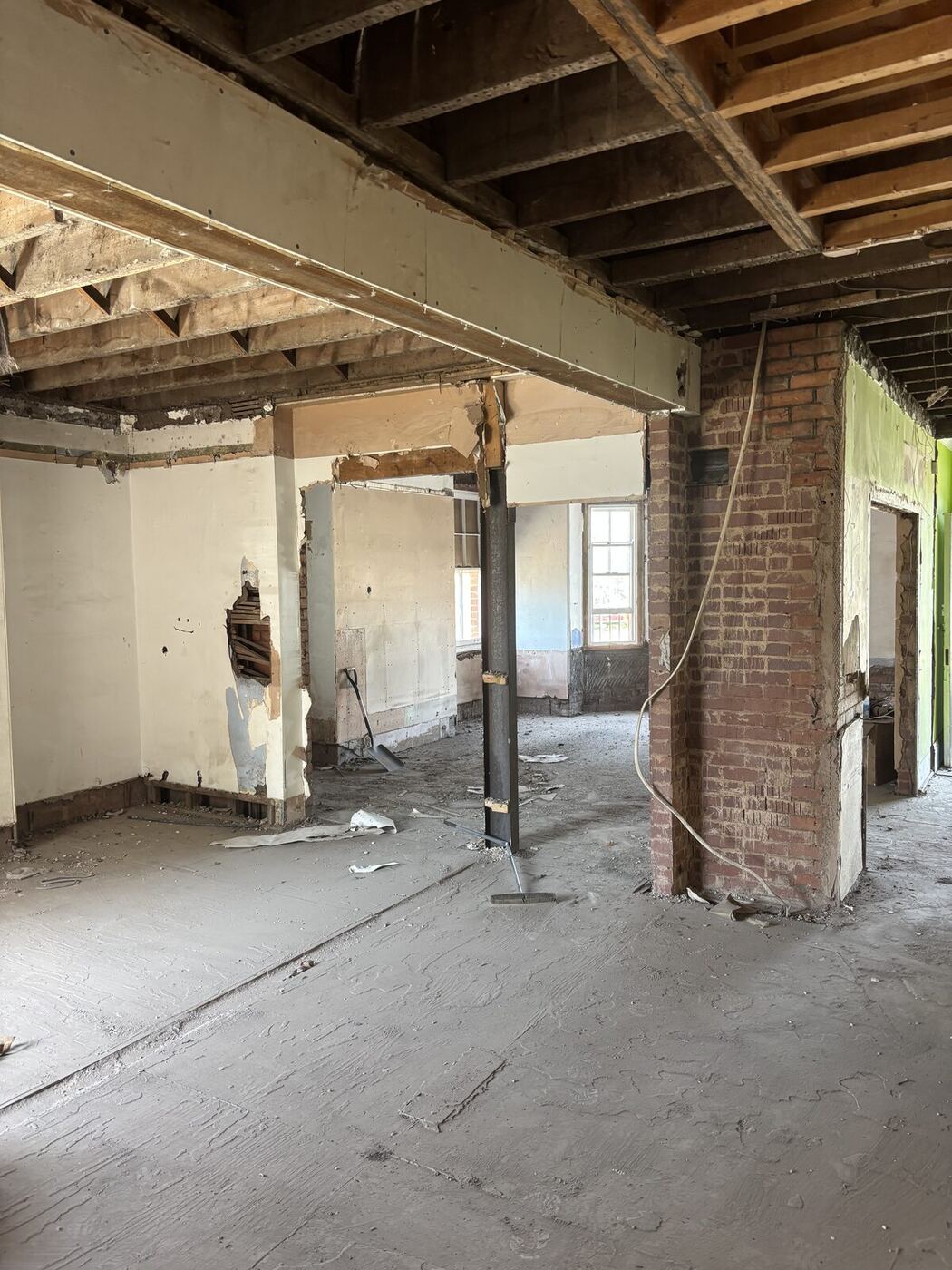 Structural steel prop supporting exposed brick pier