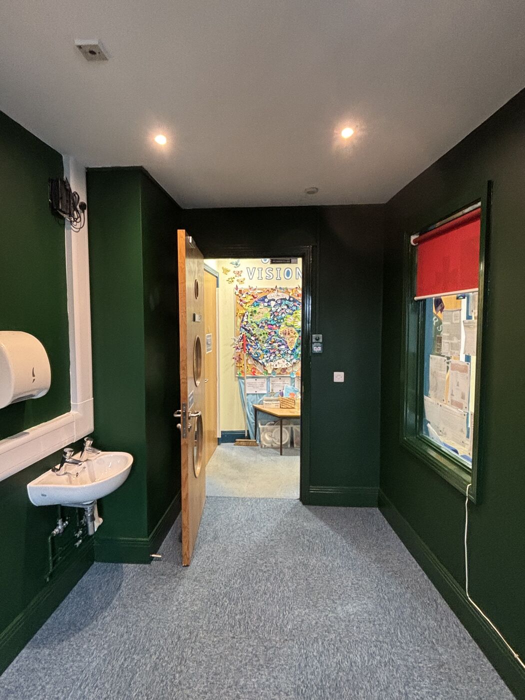 Completed office doorway with new flooring and decoration
