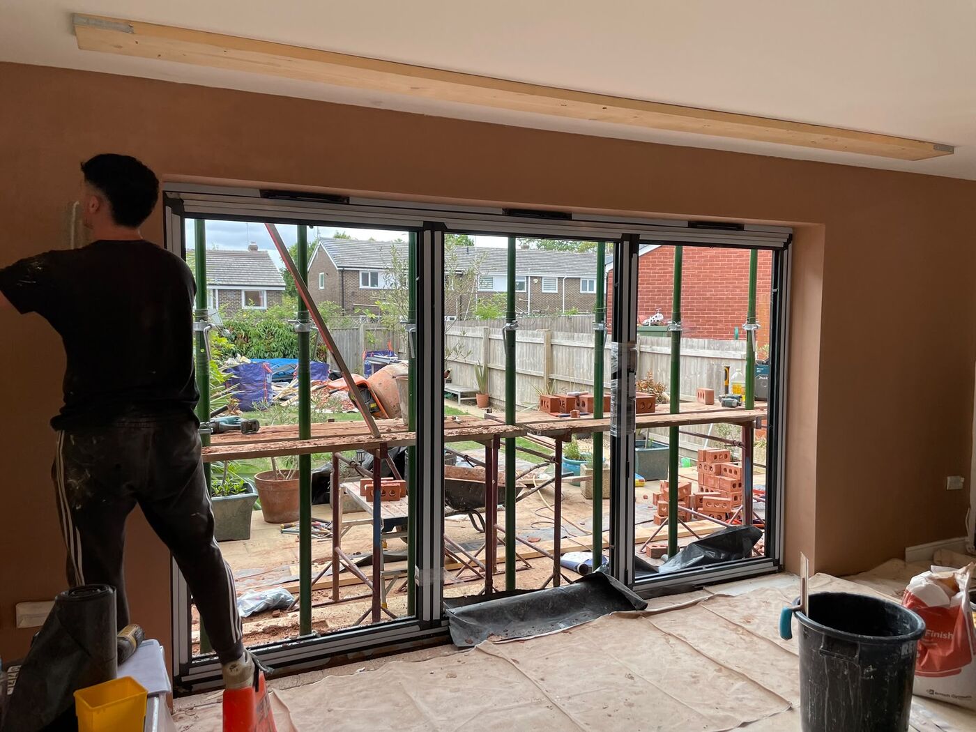 Freshly plastered reveals around the new bi-fold door opening