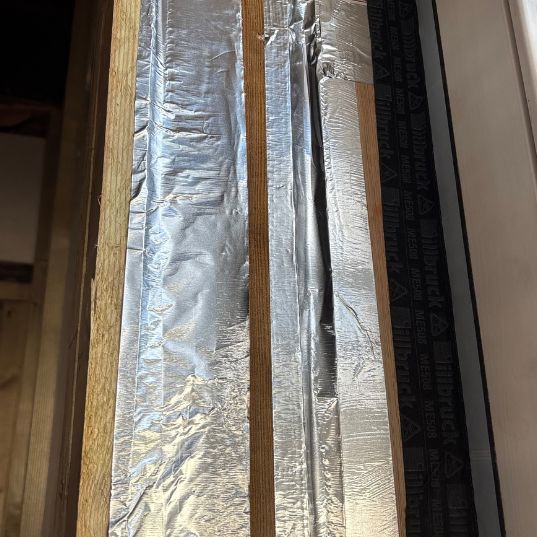 Insulation joints taped to form a vapour control layer